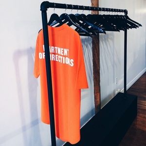 “Usual Suspect” New Regime orange tshirt